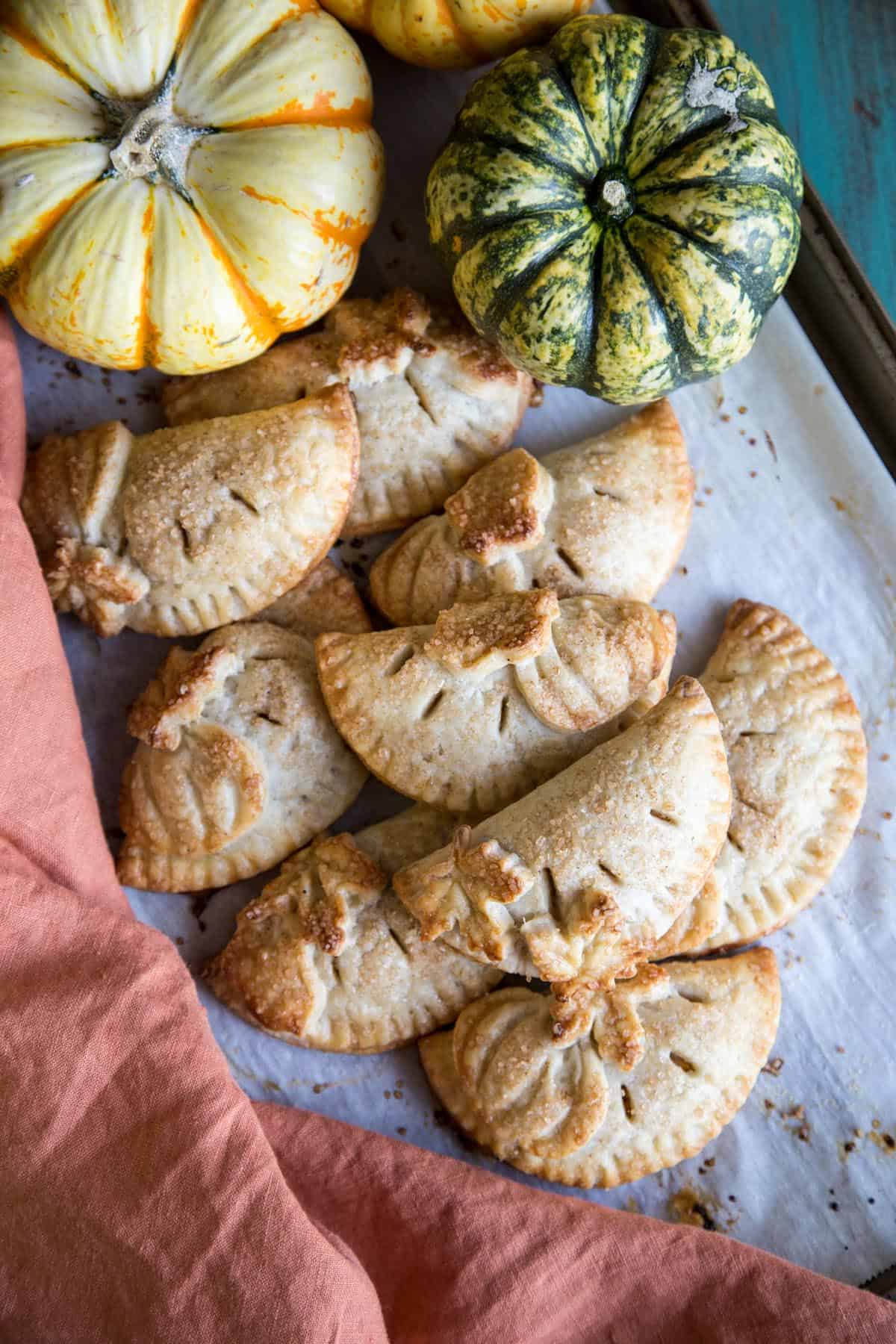 Pumpkin hand pies on a baking tray
