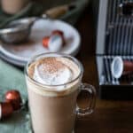 Hazelnut mocha topped with whipped cream and cocoa powder