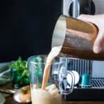 Pouring Vietnamese iced coffee into a mug