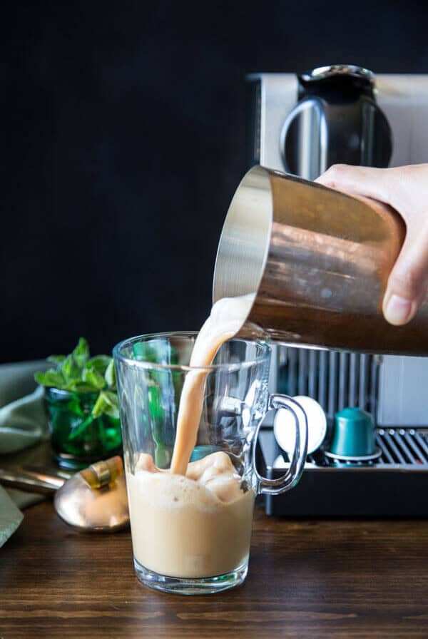 Pouring Vietnamese iced coffee into a mug