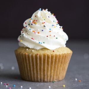 Vanilla buttercream frosting on top a cupcake.