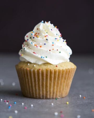 Vanilla buttercream frosting on top a cupcake