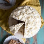 Hummingbird cake on a cake stand and slices on plates