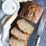 Sliced banana bread on a wire rack.
