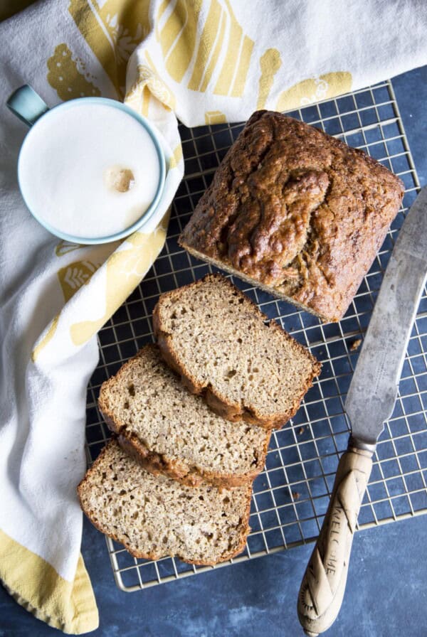 Sliced banana bread on a wire rack.