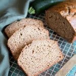 Sliced zucchini bread on a wire rack