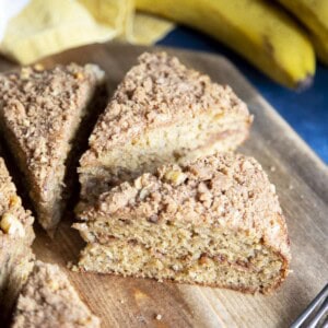 Slices of banana coffee cake on a wooden board.