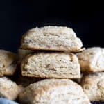 A stack of whole wheat biscuits on a wire rack.