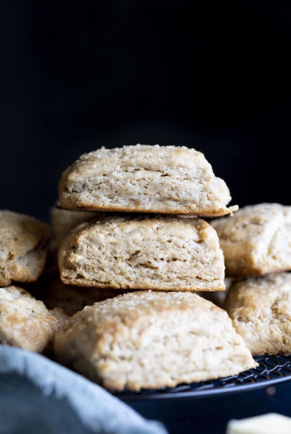 A stack of whole wheat biscuits on a wire rack.