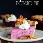 A slice of purple sweet potato pie with whipped cream.