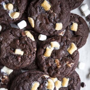Chocolate marshmallow cookies piled on top of each other.