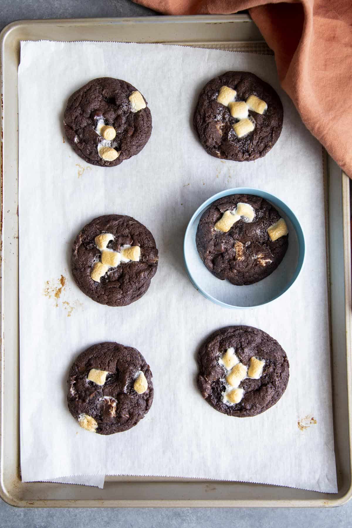 Making the cookies perfectly round with a round cookie cutter.