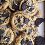 A pile of Oreo chocolate chip cookies inside a baking tray.