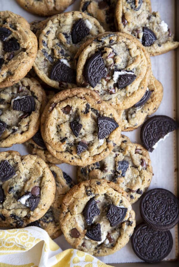 A pile of Oreo chocolate chip cookies inside a baking tray.