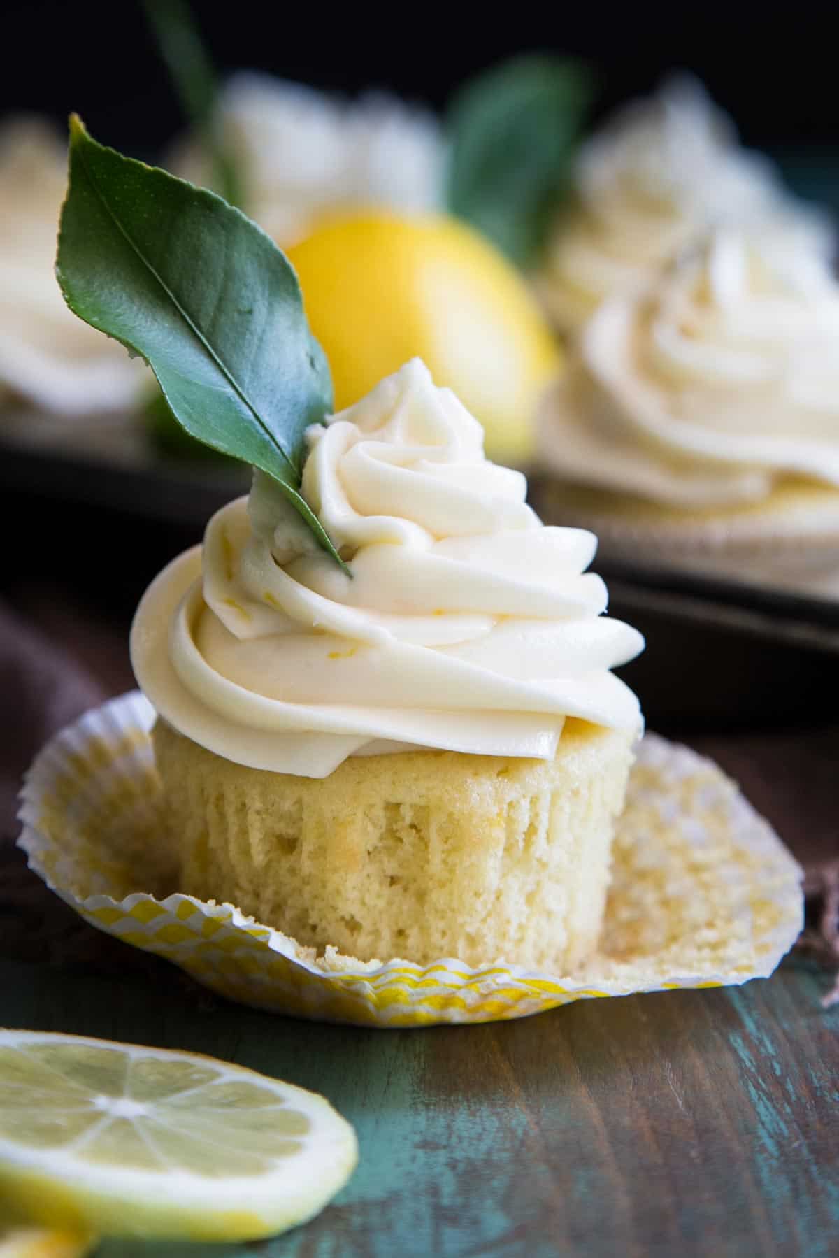 Lemon cream cheese frosting on a lemon cupcake.