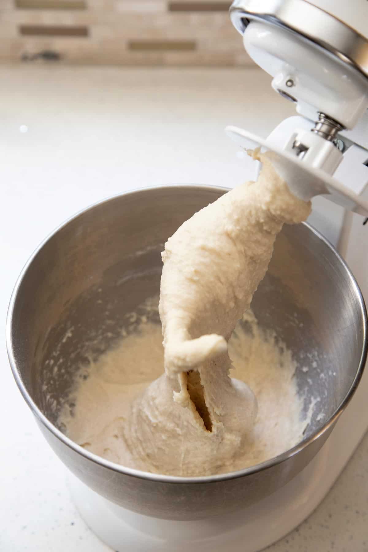 Cinnamon roll dough in a stand mixer.