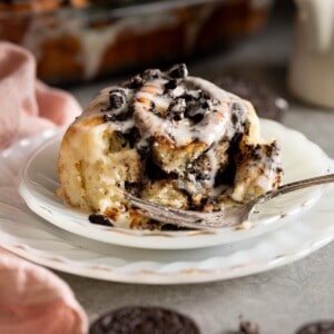 An Oreo cinnamon rolls on a white plate.