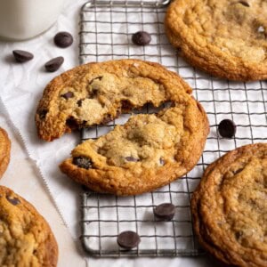 Close up of a toffee chocolate chip cookie, broken in half.
