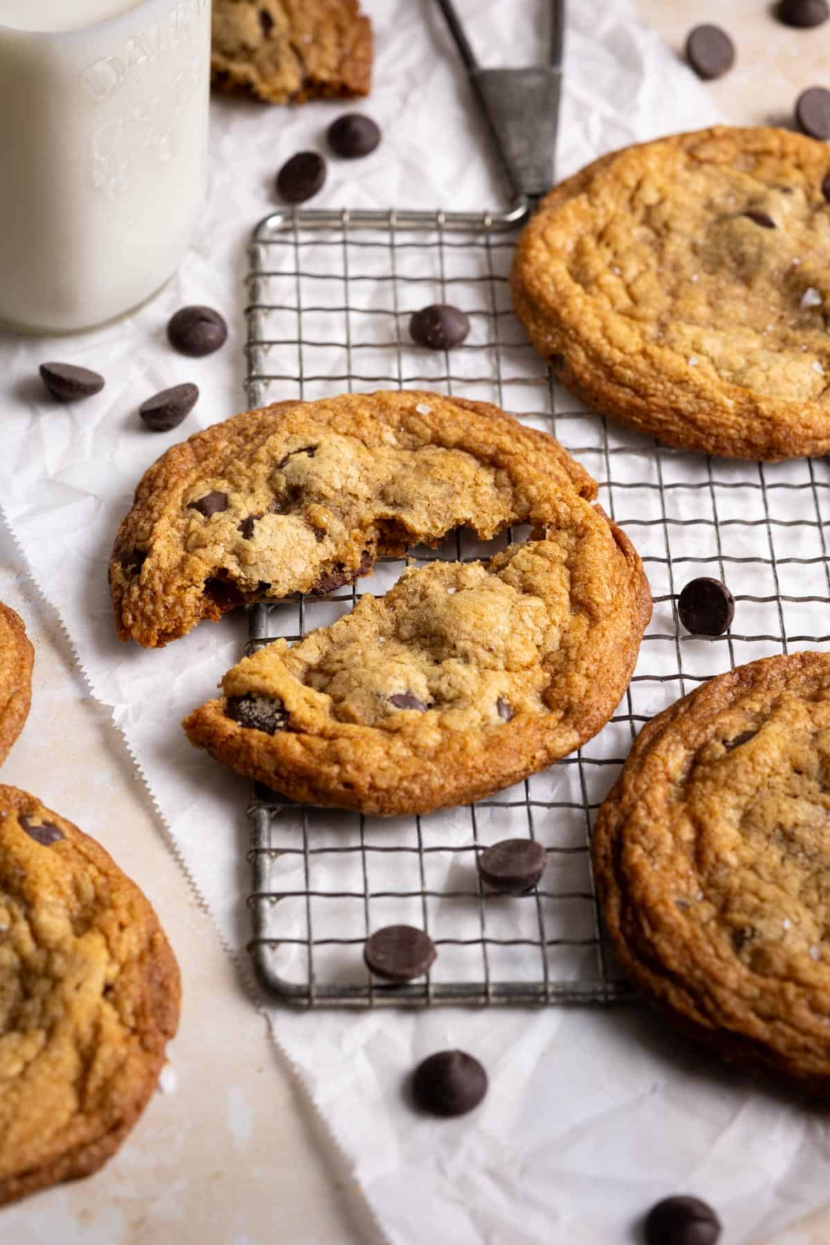 Close up of a toffee chocolate chip cookie, broken in half.
