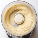 Almond frangipane in the bowl of a food processor.