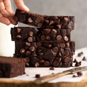 A stack of 4 slices of chocolate bread.