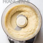 Almond frangipane in the bowl of a food processor.