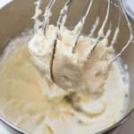 Lemon cream cheese frosting in a stand mixer.