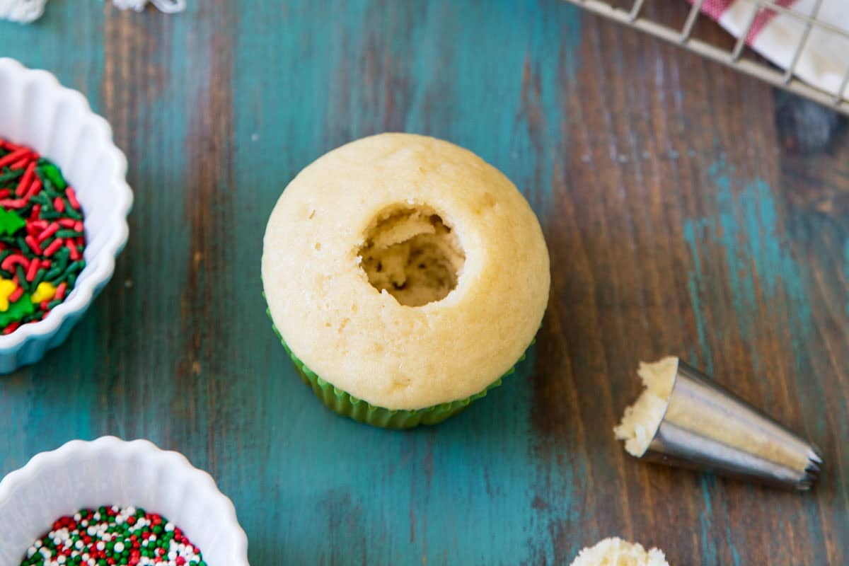 Cutting out a hole in the middle of your cupcake for filling.