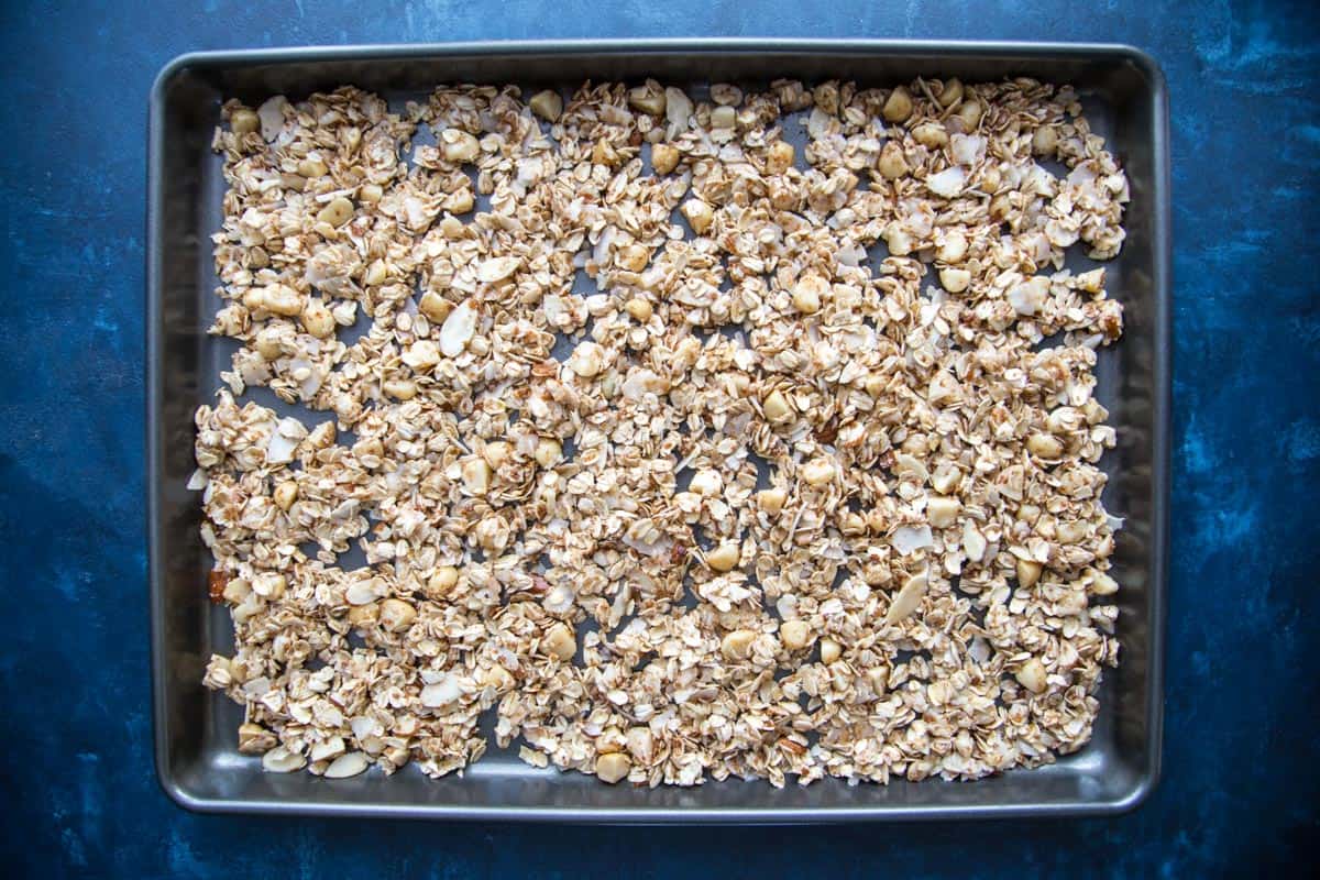 Unbaked granola on a baking sheet.