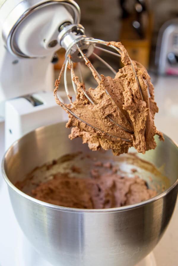 Chocolate swiss meringue buttercream in a stand mixer.