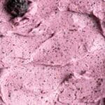 Close up overhead shot of blueberry cake frosting.