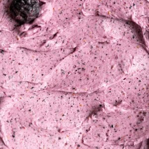 Close up overhead shot of blueberry cake frosting.