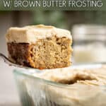 A cake server lifting a piece of miso banana cake from a glass dish.