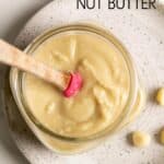 Macadamia butter spread in a glass jar.