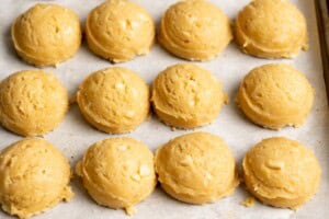 Macadamia nut cookie dough is portioned into balls.