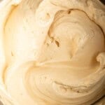 Miso caramel frosting inside a stand mixer bowl.