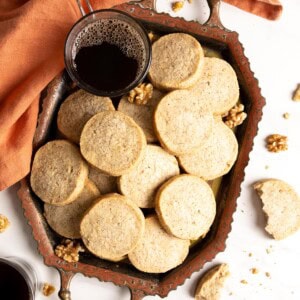 A tray of walnut shortbread with black coffee.