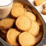 Golden brown molasses shortbread cookies in a metal tray.