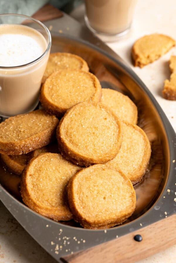 Golden brown molasses shortbread cookies in a metal tray.