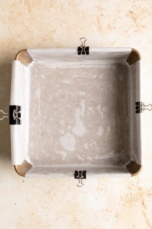 Buttered and lined baking pan.