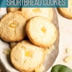 Pineapple shortbread cookies on a plate with text overlay.