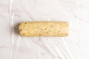 A log of pistachio cookie dough.