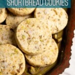 Pistachio shortbread cookies on a tray.