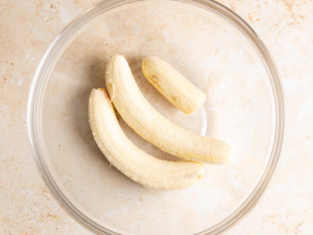 Bananas in a glass bowl.