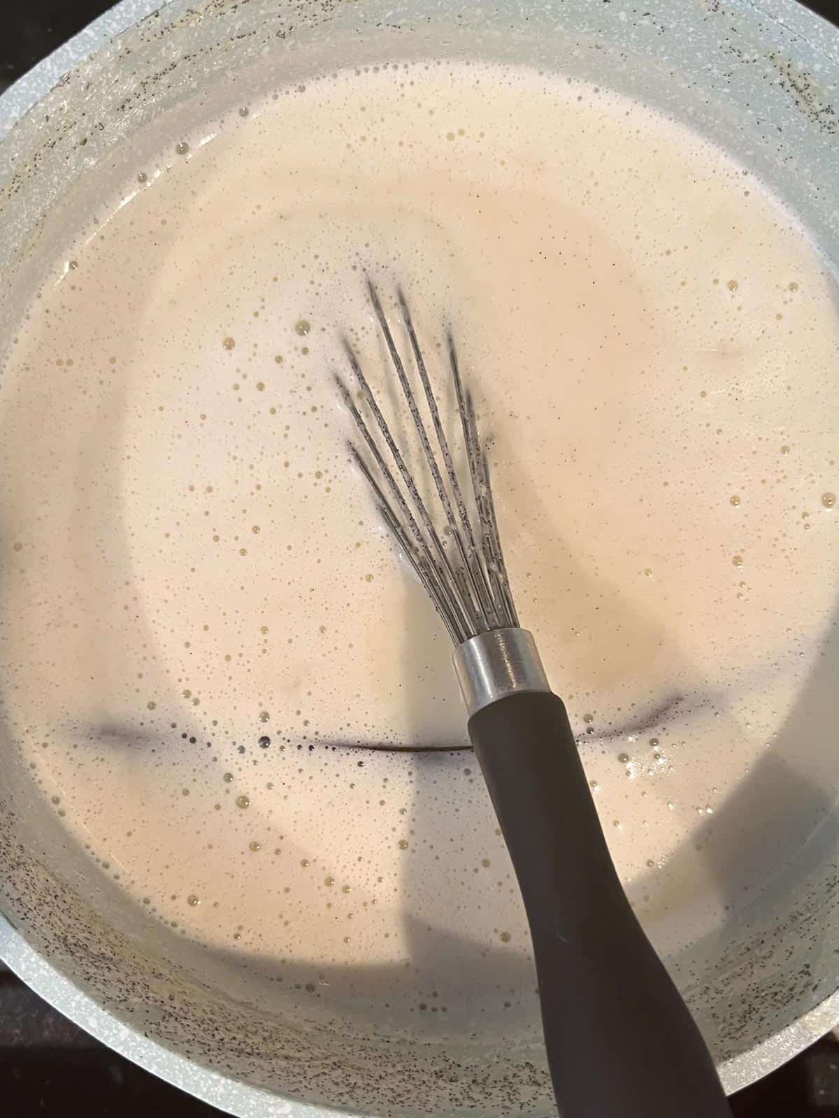 The milk mixture starts to take on color at 9:32 am.