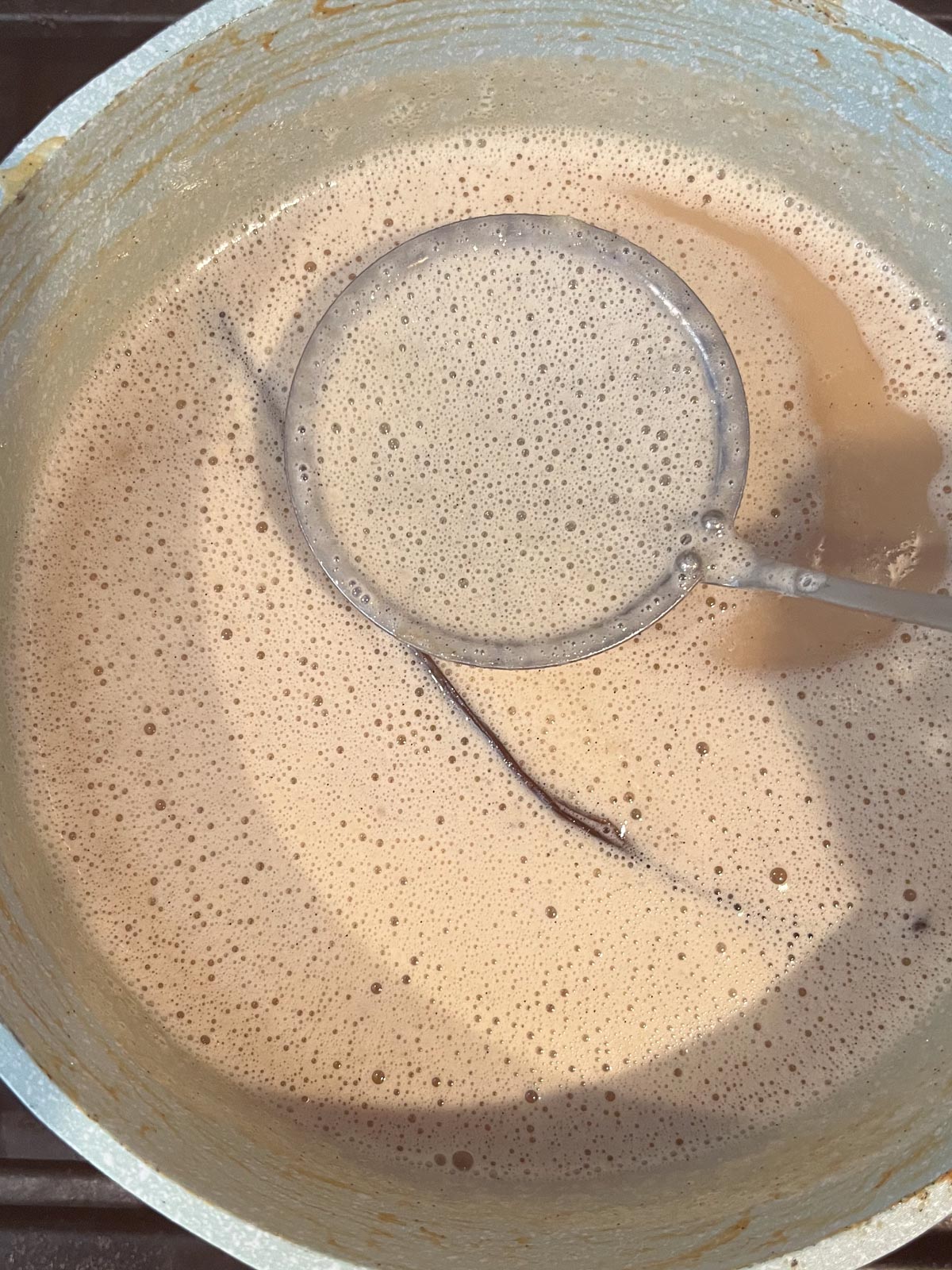 Remove foam from the milk mixture.