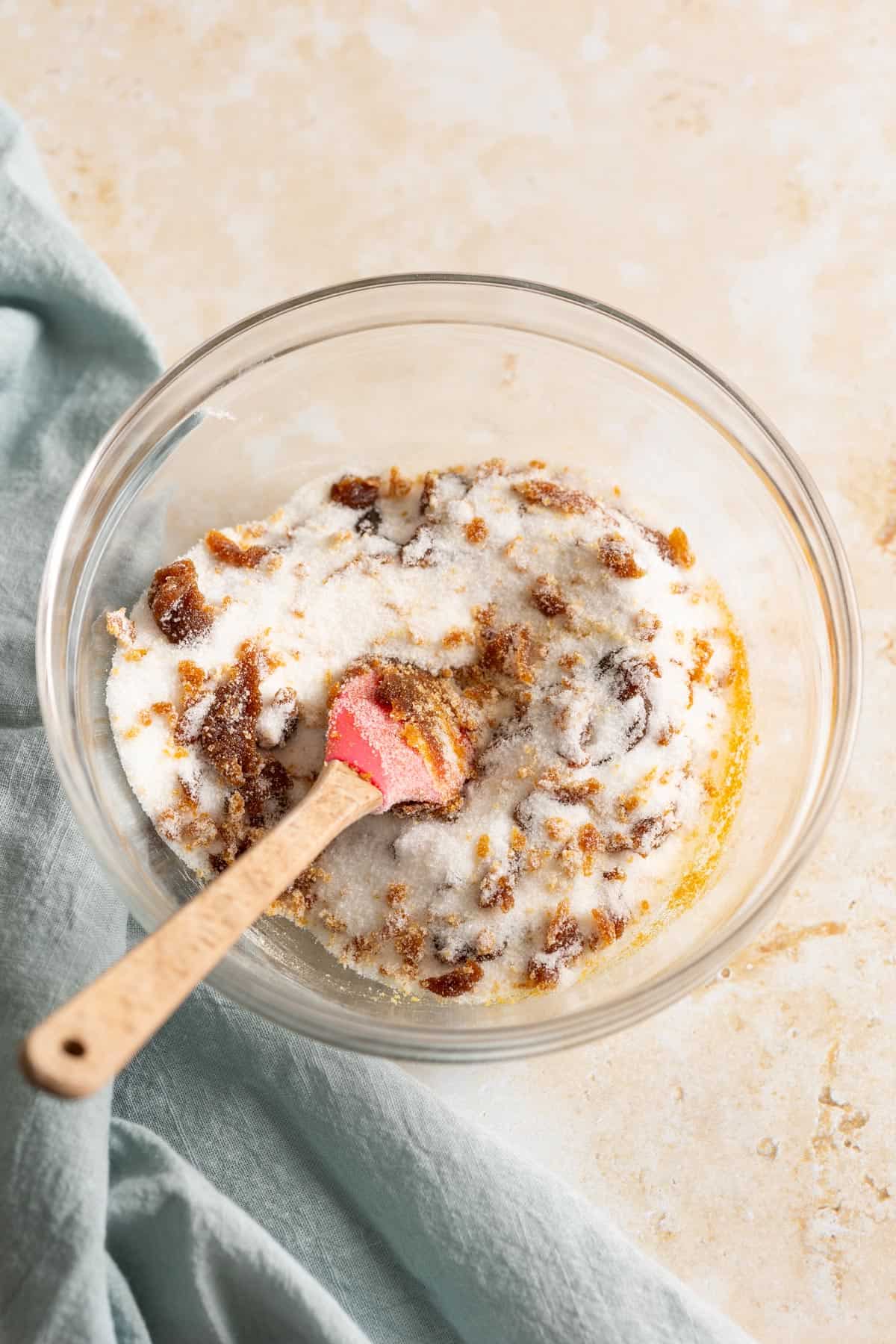 Mixing sugar with molasses.