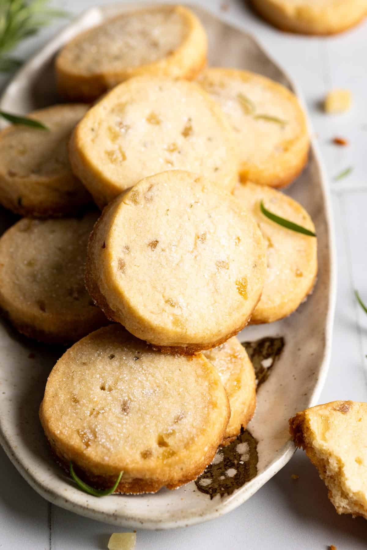 Rosemary shortbread cookies on an oval plate.