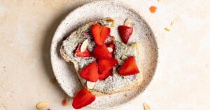 Matcha bostock on a plate with more strawberries.