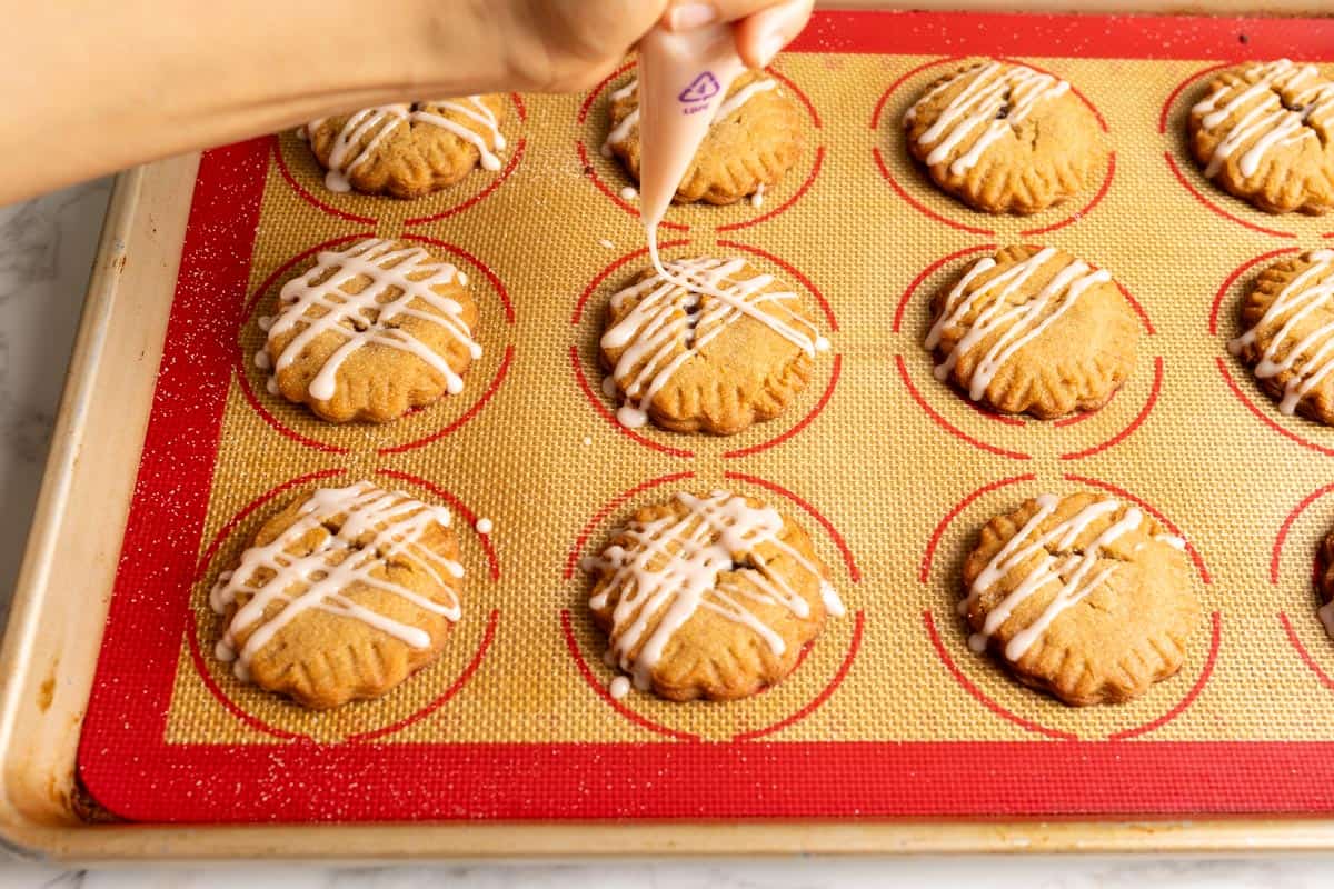 Drizzle glaze on top of cookies.